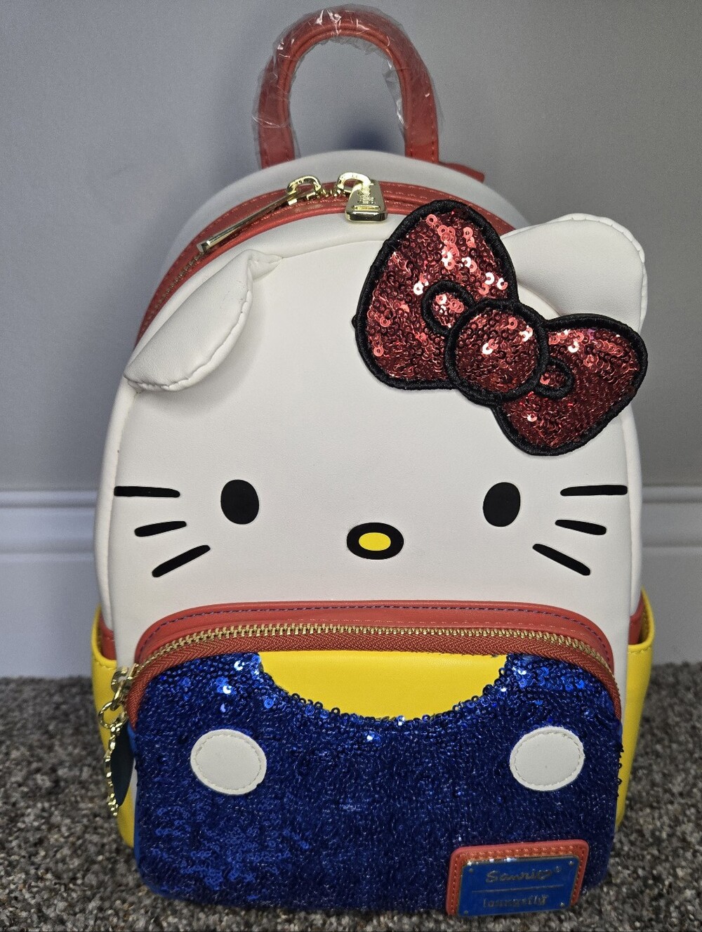 Hello Kitty Mini Backpack with Red Bow, White Face, Yellow & Blue Accents